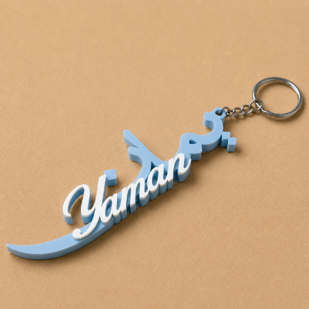 Customized Arabic and English name charm- light blue & white, personalized with your chosen name in an elegant bilingual design, perfect for adding a unique personal touch to your accessories or as a thoughtful gift.
