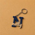 Customized name medals featuring each customer’s name and initial, creating a unique personalized accessory designed especially for them, navy and ivory