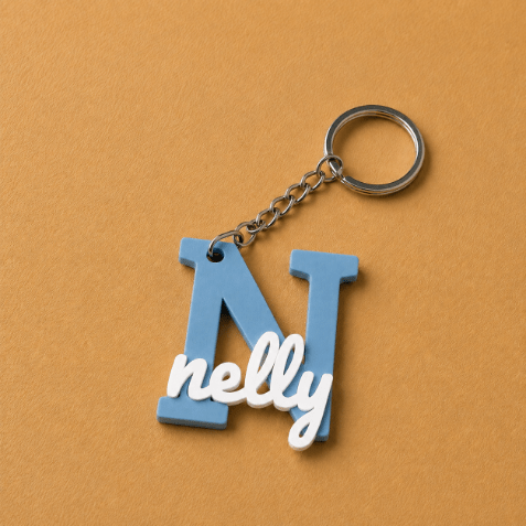 Customized name medals featuring each customer’s name and initial, creating a unique personalized accessory designed especially for them, light blue and white