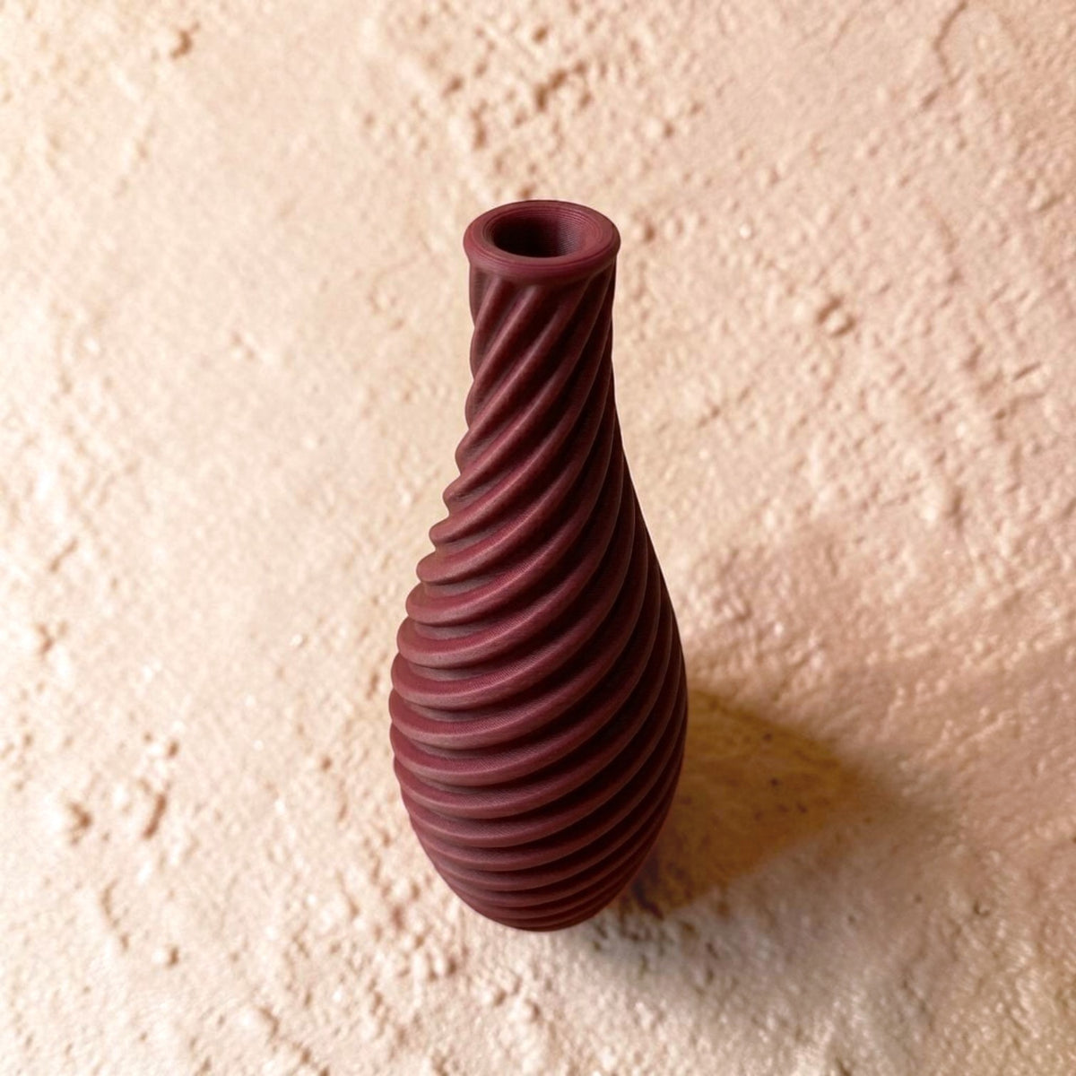 Spiral vase collection featuring elegant sculptural curves and a modern twisted design, perfect for flowers or as stylish decorative pieces for any space.