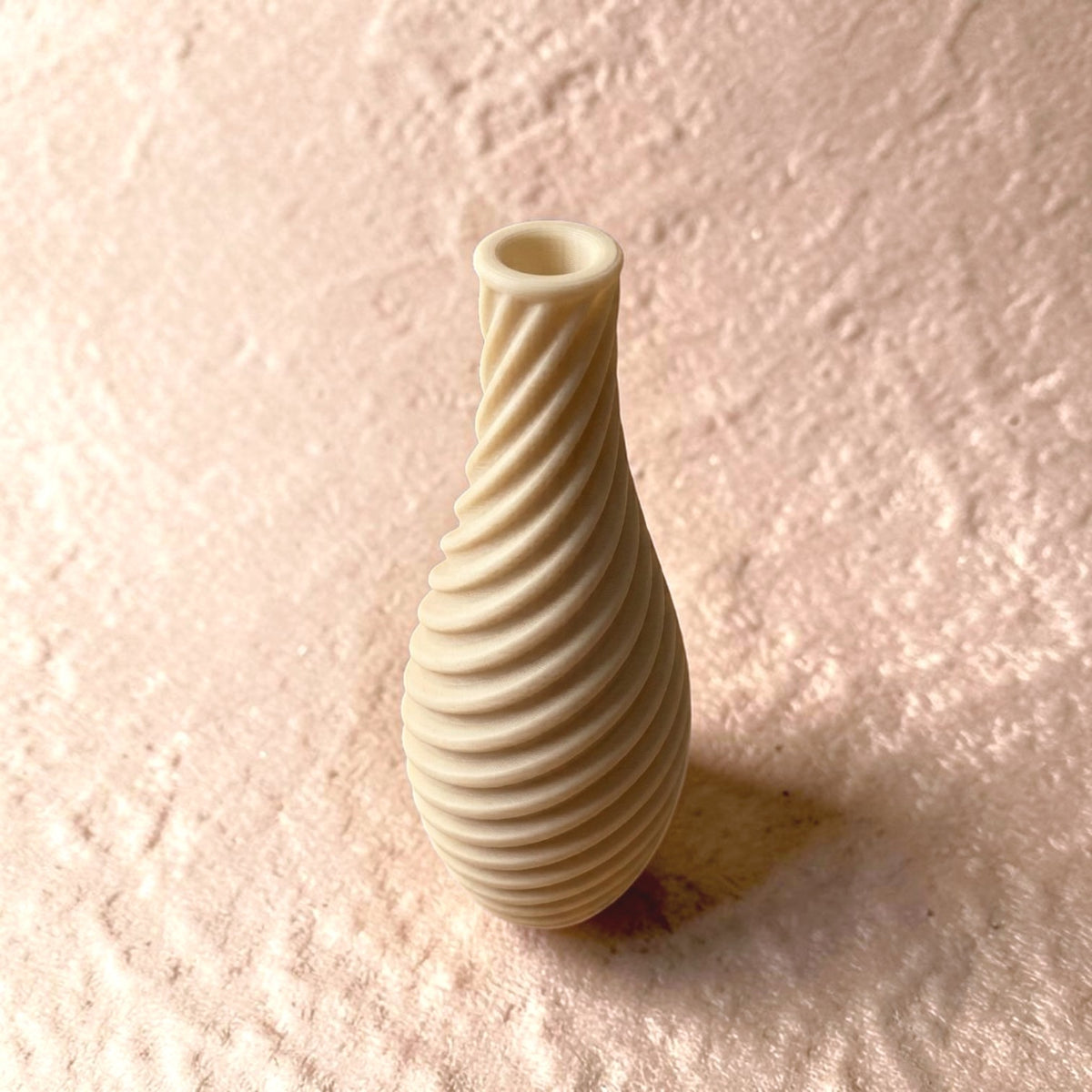 Spiral vase collection featuring elegant sculptural curves and a modern twisted design, perfect for flowers or as stylish decorative pieces for any space.