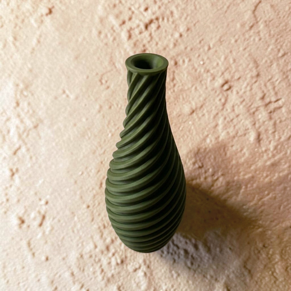 Spiral vase collection featuring elegant sculptural curves and a modern twisted design, perfect for flowers or as stylish decorative pieces for any space.