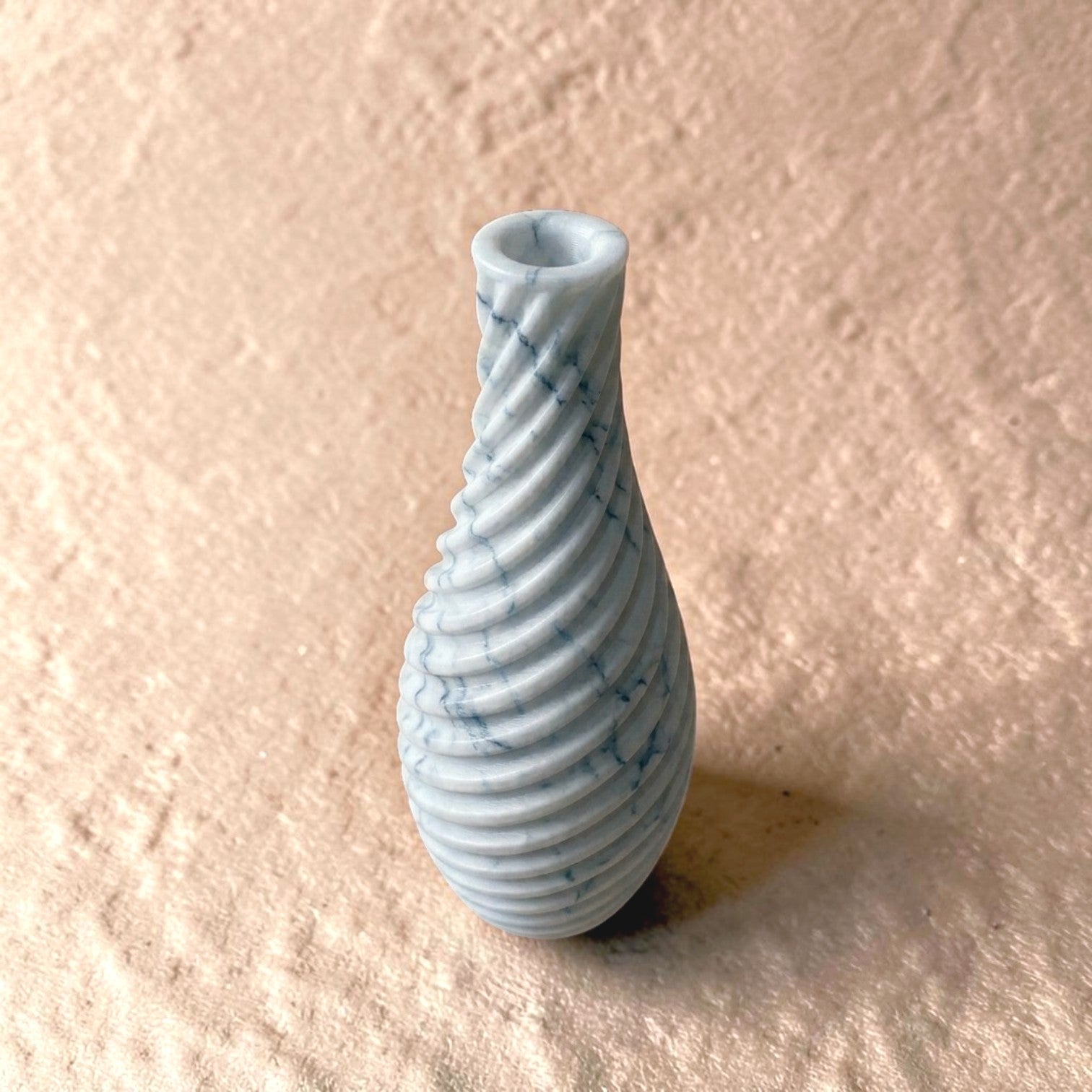 Spiral vase collection featuring elegant sculptural curves and a modern twisted design, perfect for flowers or as stylish decorative pieces for any space.