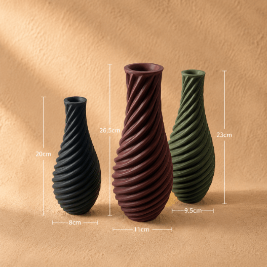 Spiral vase collection featuring elegant sculptural curves and a modern twisted design, perfect for flowers or as stylish decorative pieces for any space.