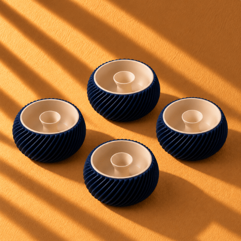 Mini Shell & Seed 3D-printed bowl in Navy and ivory, featuring a textured shell-inspired exterior and a small raised seed-shaped center, styled as elegant home décor.
