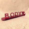 Personalized 3D printed name sign featuring the custom name Body with a heart accent, crafted in premium burgundy PLA. Freestanding custom desk name plate and personalized gift for couples, bedrooms, offices, and home décor.