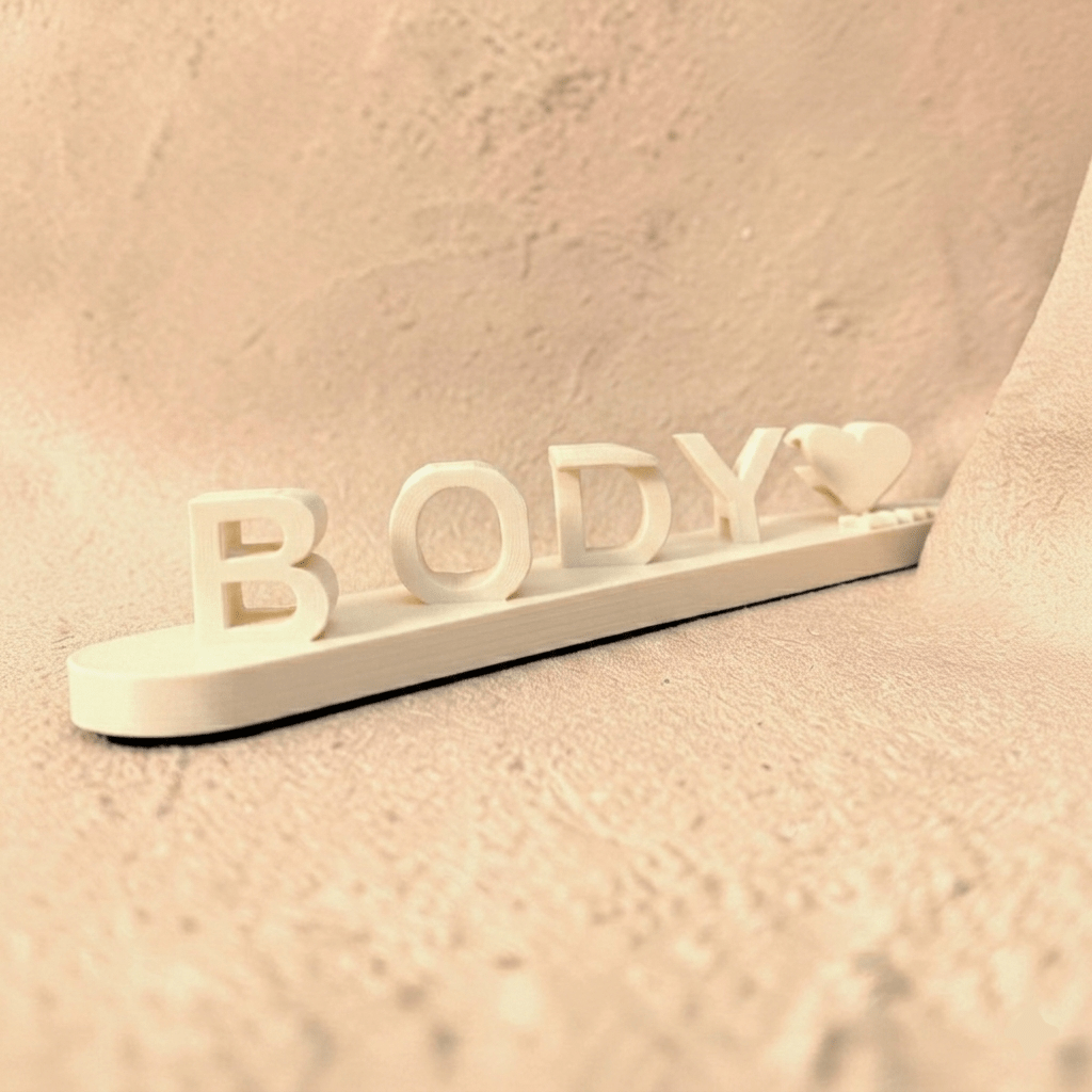 Personalized 3D printed name sign featuring the custom name Body with a heart accent, crafted in premium ivory PLA. Freestanding custom desk name plate and personalized gift for couples, bedrooms, offices, and home décor.