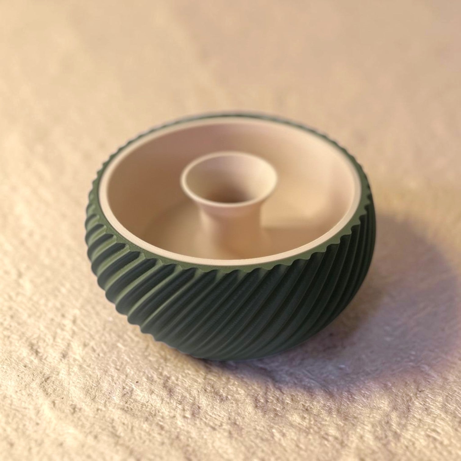 Shell & Seed snack bowl featuring a unique spiral outer-edge design, perfect for serving seeds, nuts, and other snacks while keeping shells and waste neatly separated.