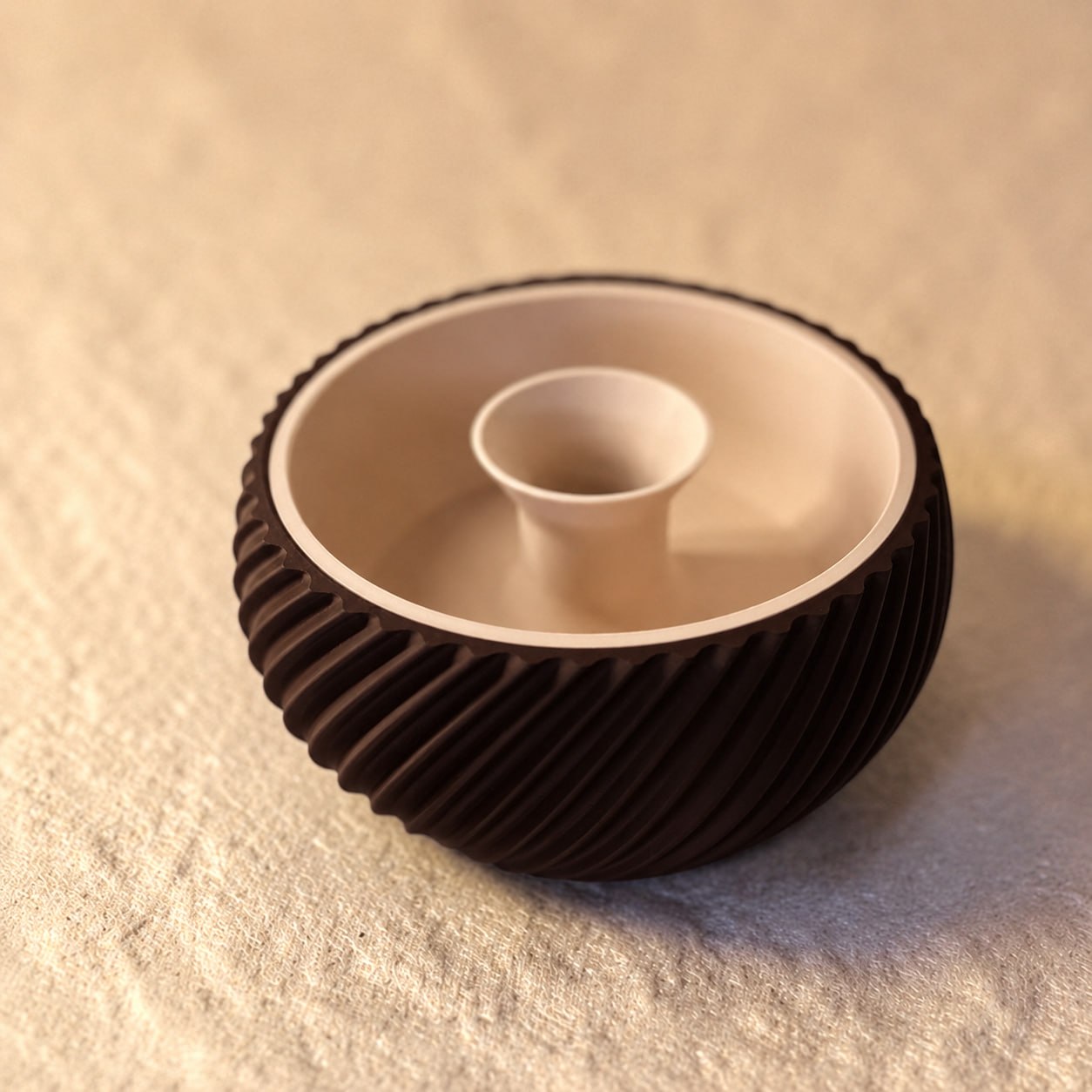 Shell & Seed snack bowl featuring a unique spiral outer-edge design, perfect for serving seeds, nuts, and other snacks while keeping shells and waste neatly separated.