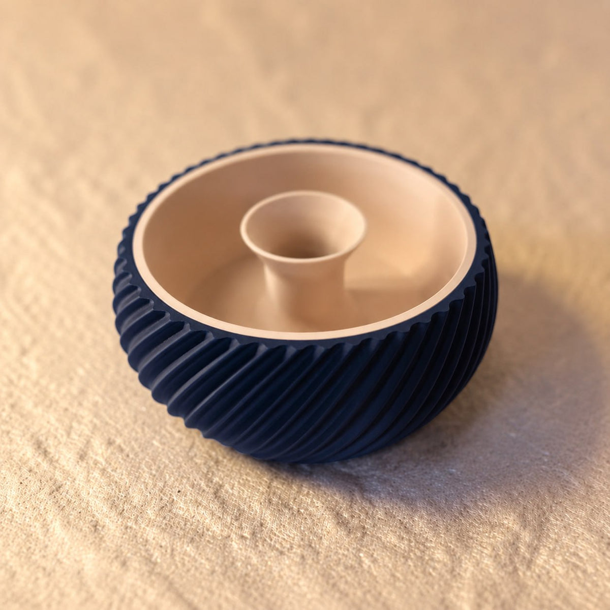 Shell & Seed snack bowl featuring a unique spiral outer-edge design, perfect for serving seeds, nuts, and other snacks while keeping shells and waste neatly separated.