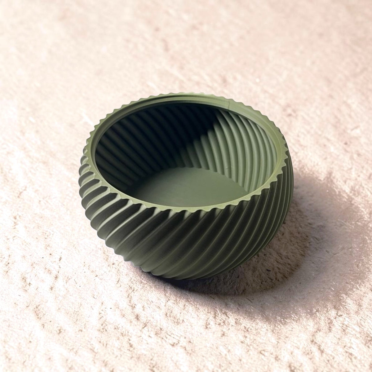 Shell & Seed snack bowl featuring a unique spiral outer-edge design, perfect for serving seeds, nuts, and other snacks while keeping shells and waste neatly separated.