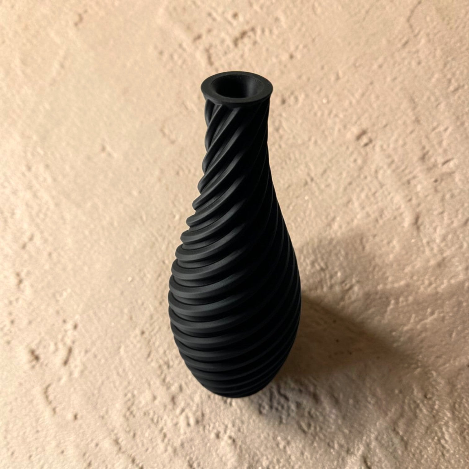 Spiral vase collection featuring elegant sculptural curves and a modern twisted design, perfect for flowers or as stylish decorative pieces for any space.