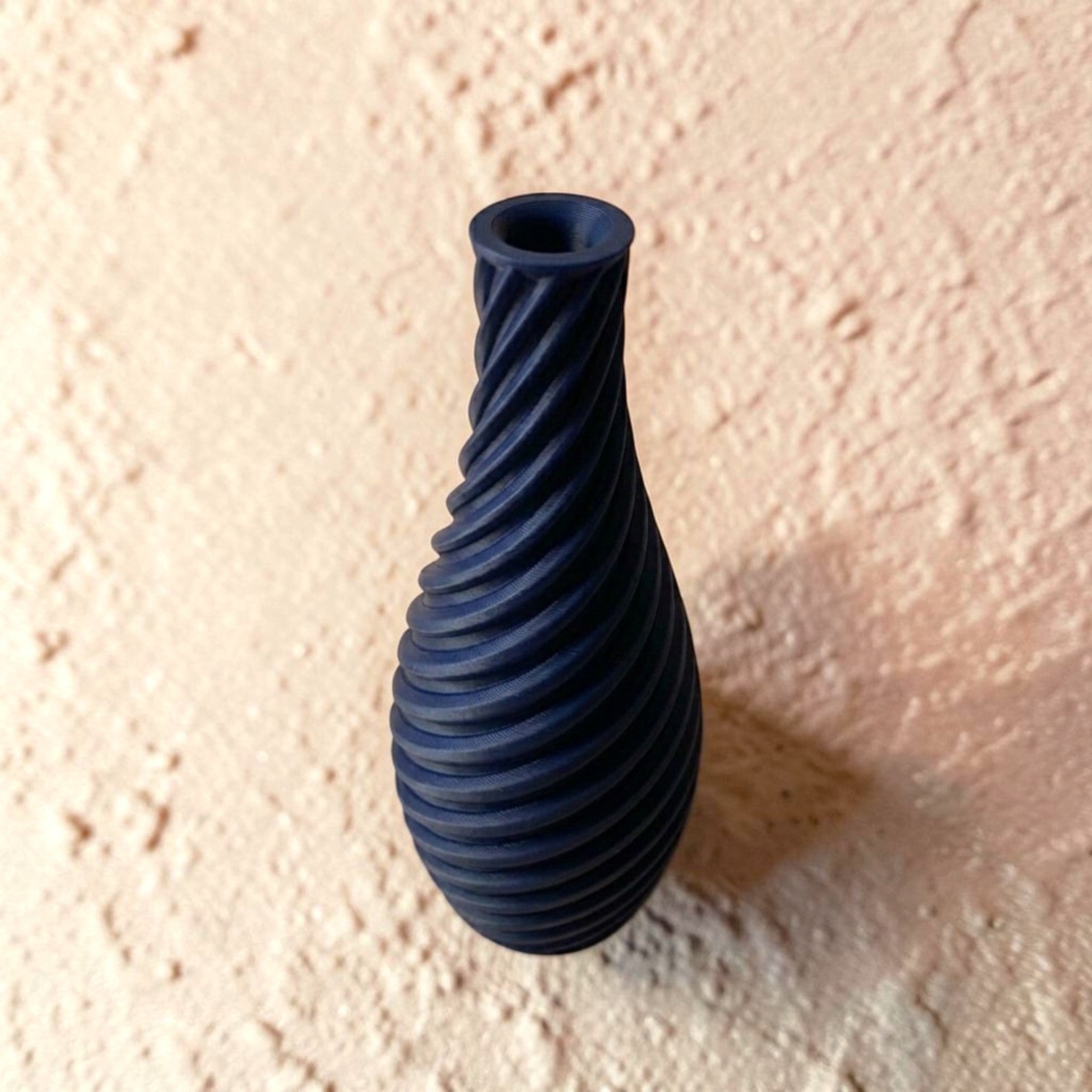 Spiral vase collection featuring elegant sculptural curves and a modern twisted design, perfect for flowers or as stylish decorative pieces for any space.